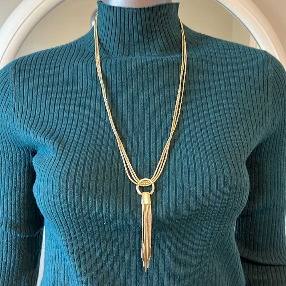 Triple strand gold colored necklace